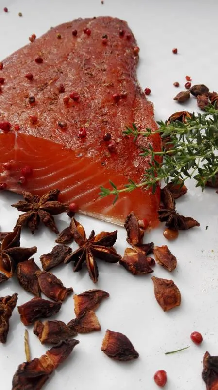 Salmon marinated with brown sugar, pink berries and star anise