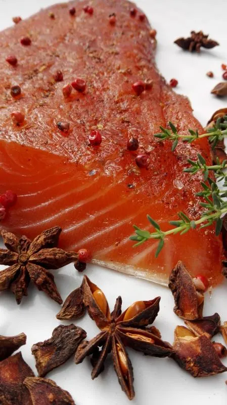 Salmon marinated with brown sugar, pink berries and star anise