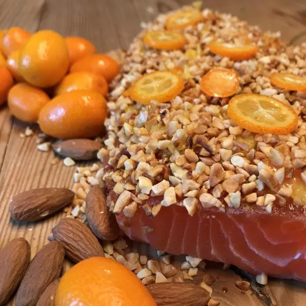 Graved salmon with roasted almonds and kumquats