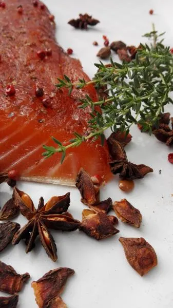 Salmon marinated with brown sugar, pink berries and star anise