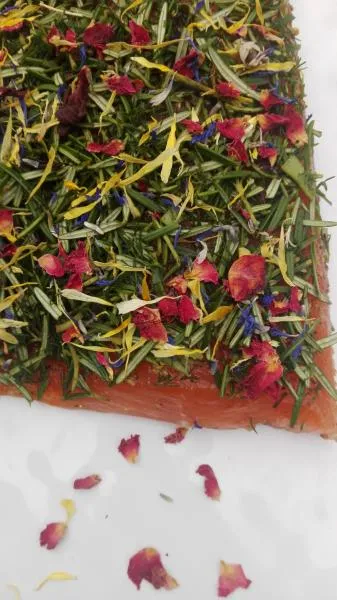 Salmon marinated with rosemary, dill and flower mix